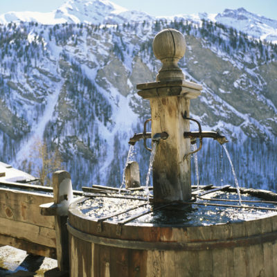 Wooden fountain in the french Alps